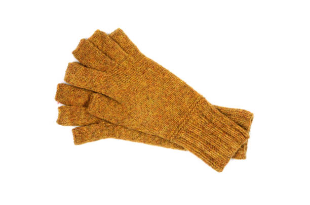 istock Yellow knitted gloves with open fingers isolated on white background. 1073702212