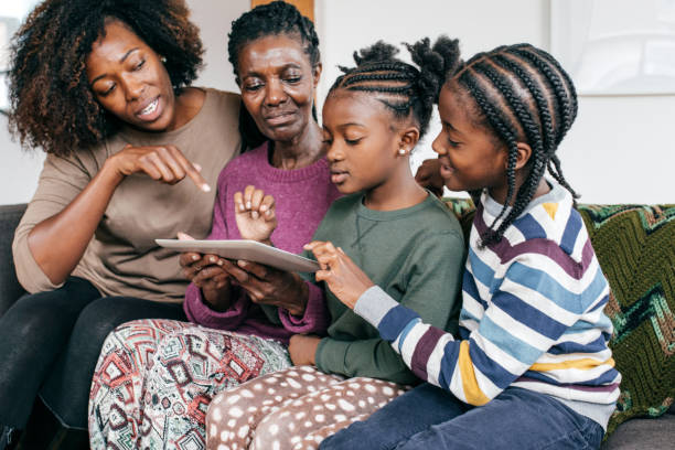 istock Showing new online tricks to grandmother 1073702572