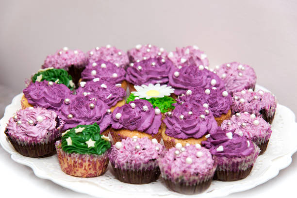 istock Close up of small sweet canapes arranged on a mirror plate over light background - selective focus 1073708142
