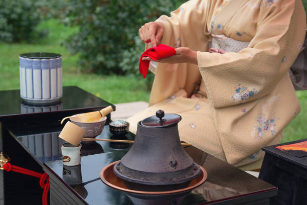 istock Woman in kimono performs Japanese tea ceremony 1073708726