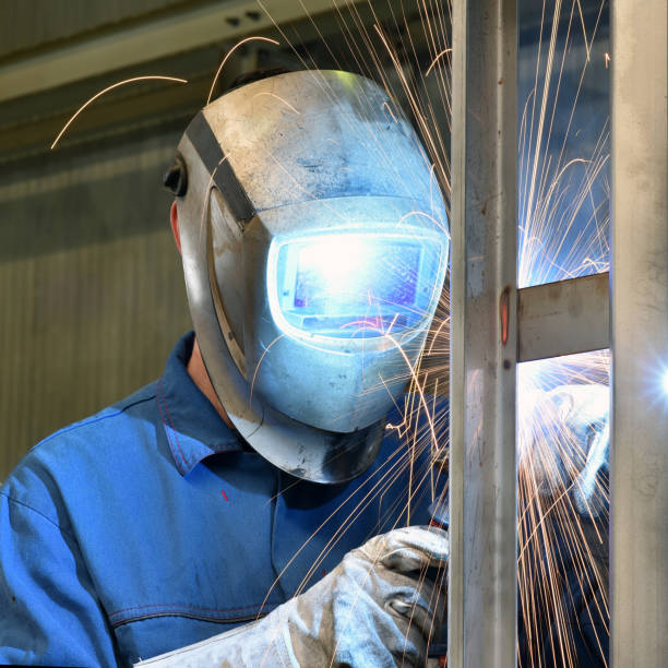 istock welder works in metal construction - construction and processing of steel components 1073712370