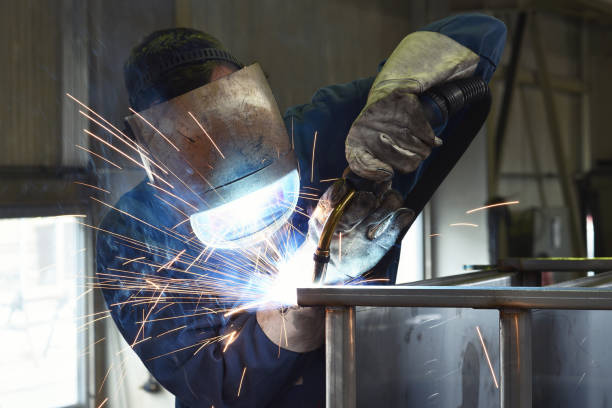 istock welder works in metal construction - construction and processing of steel components 1073715286