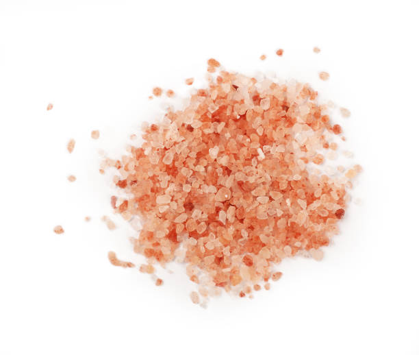 istock Close up pink Himalayan salt isolated on white 1073715528