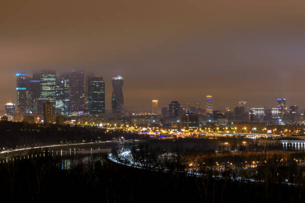 istock city night lights panorama fog 1073734904
