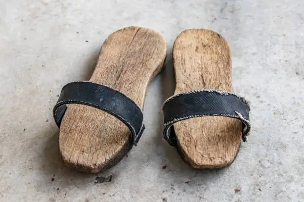 a pair of clogs for turkish bath.shoes with a thick wooden sole.