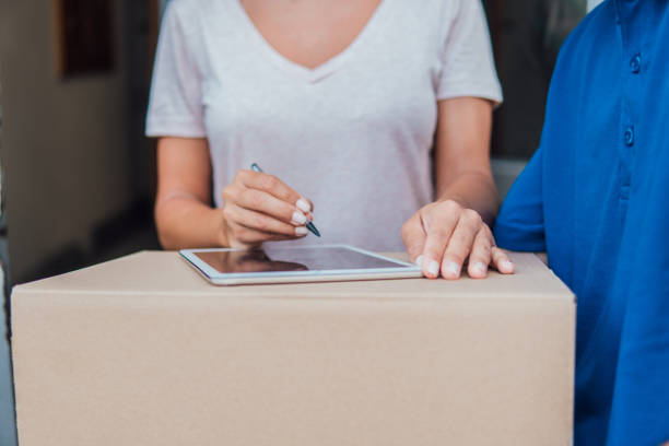 istock Signing for the delivery report on tablet 1073737354