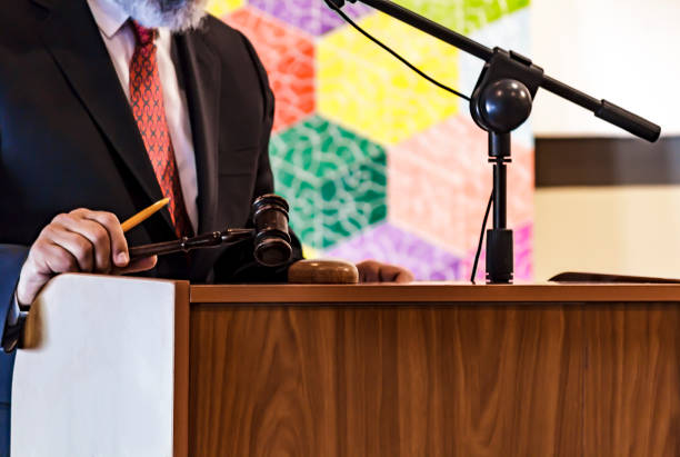 Auctioneer with his gavel. selling paintings