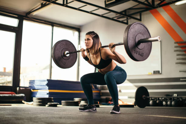 istock Young woman exercising in gym 1073744086