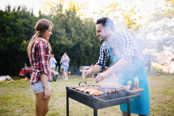 istock Happy students having barbecue on summer day 1073746596
