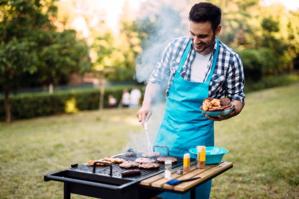 istock Happy male preparing bbq meat 1073746656