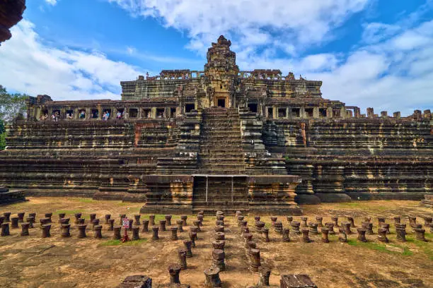 Photo of SIEM REAP, CAMBODIA - 13 December 2014:View of Baphuon temple at Angkor Wat complex is popular tourist attraction, Angkor Wat Archaeological Park in Siem Reap, Cambodia UNESCO World Heritage Site