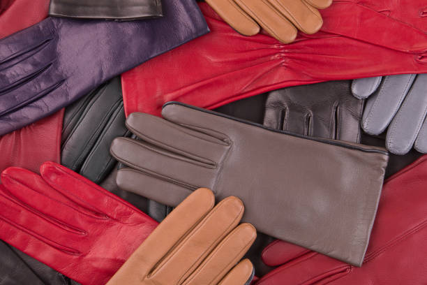 Background from colored leather gloves. Leather gloves close up.