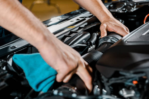 istock cropped shot of auto mechanic with rag checking automobile 1073751964