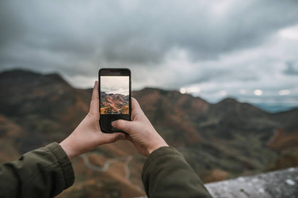 istock Taking a picture on top of a mountain 1073757436