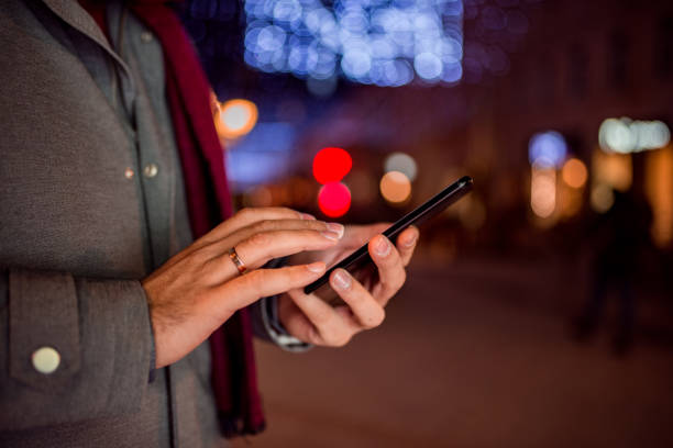 istock Close-up image of young man using smartphone. 1073758640