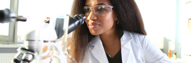 istock Black woman scientist student chemist in protective 1073764218