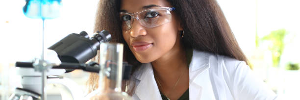 istock Black woman scientist student chemist in protective 1073764258