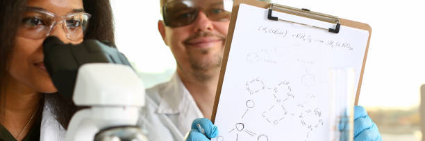 istock Two scientists of a student chemist are conducting 1073766694
