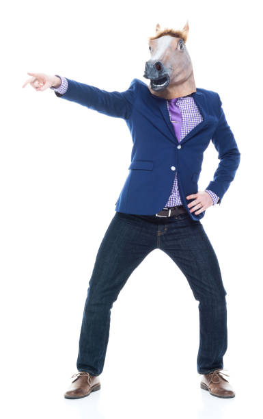 istock Businessman with horse mask is dancing 1073769224