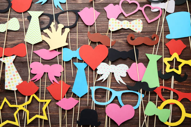 istock Paper booth props for party on brown wooden table 1073769308
