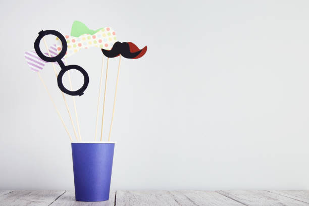 istock Paper booth props for party in cup on gray background 1073770736