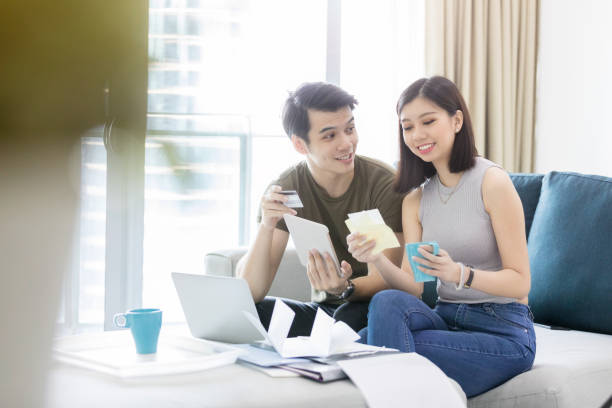 istock Young couple discuss credit card debt 1073772448