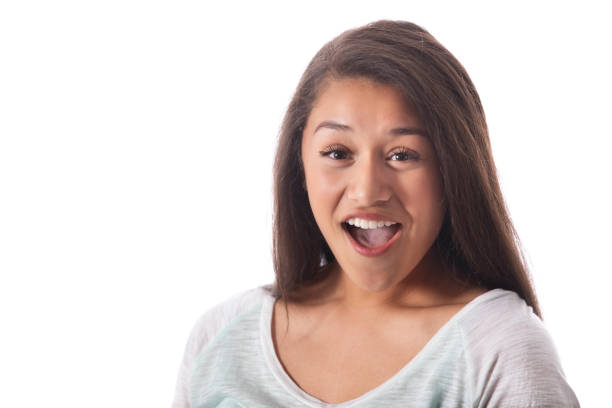 istock Young female looks at the camera with surprised expression 1073773126