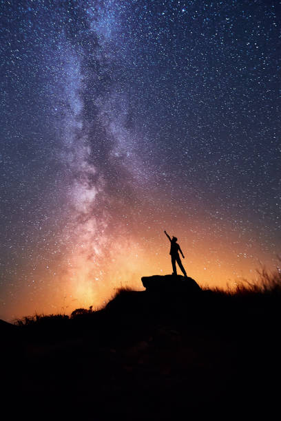 istock Man and the colorful Milky Way 1073774166