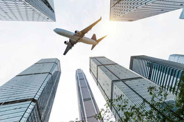 istock Business skyscraper and green leaves 1073781858