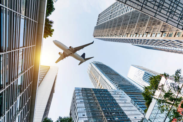 istock Business skyscraper and green leaves 1073782514