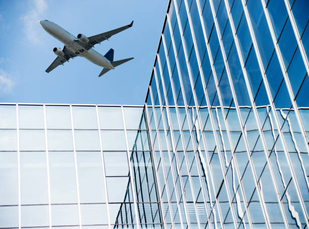 istock Office building wall reflecting the blue sky 1073785668