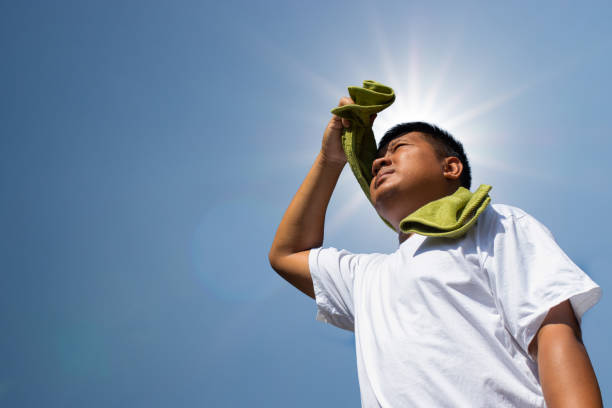istock Young man and heat stroke. 1073787346