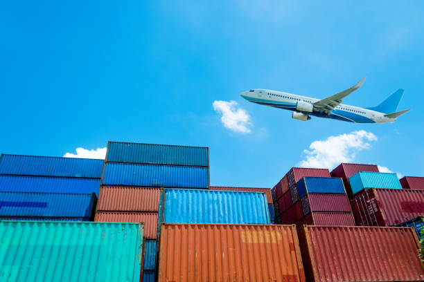 istock Air freight and stack of cargo containers at the docks 1073787788