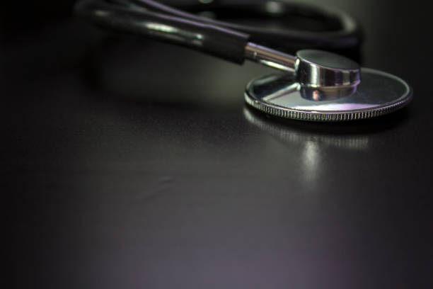 Medical Stethoscope On Black Desk Medical Check Up And Healthcare Concept  Stock Photo - Download Image Now - iStock