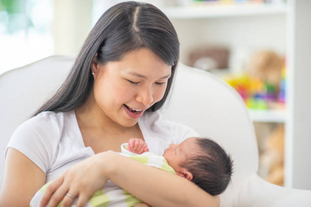 istock Baby In Mother's Arms 1073790468