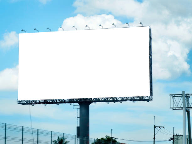 istock Blank billboard on blue sky background for new advertisement 1073790780