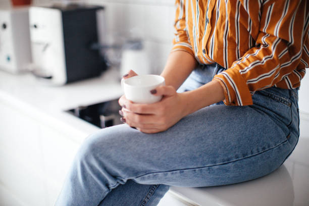 istock Thoughtful woman holding coffee mug 1073796876