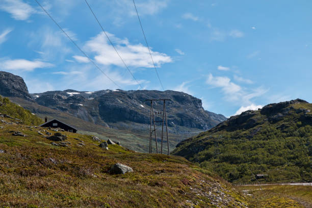 istock Power Pylons in the Mountains 1073797790