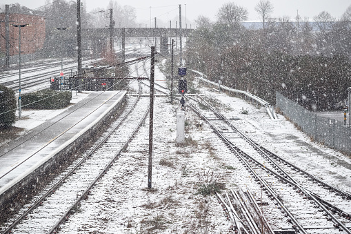 Railway tracks covered in winter snow at Welwyn Garden City, Hertfordshire, UK