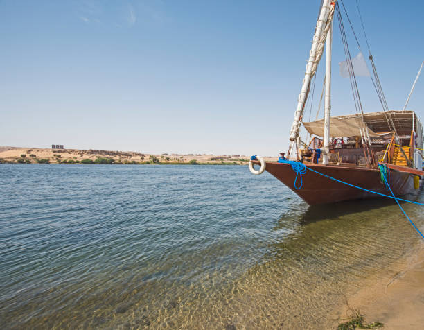 istock Large egyptian dahabeya river boat moored on the Nile 1073799598