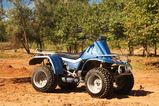 istock Blue quad on sand on the road, safari 1073814872