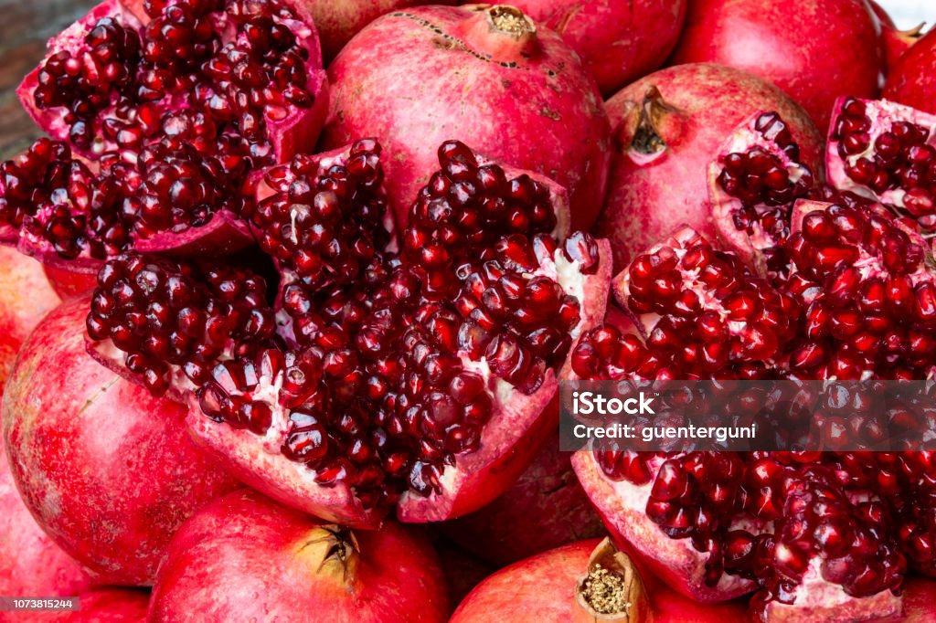 Close up of fresh and juicy pomegranate Close up of fresh harvested juicy pomegranate Pomegranate Stock Photo