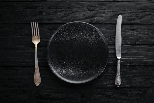 istock Clay dishes. A plate on a black background. Top view. Free copy space. 1073816394