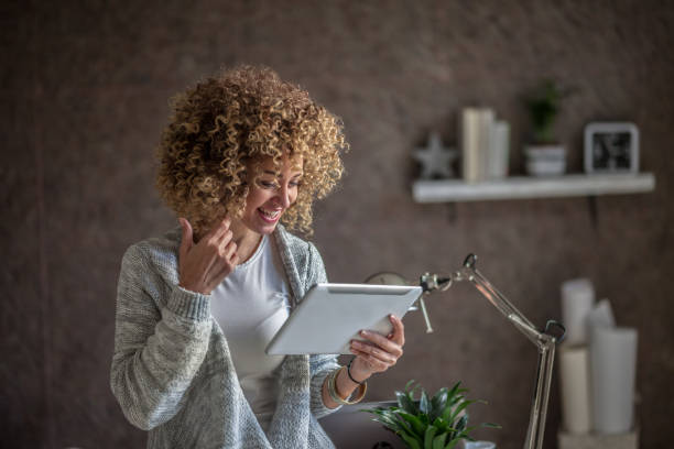 istock businesswoman using tablet    in office 1073818568