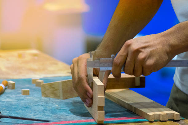 istock Carpenter working with timber in shop 1073821950