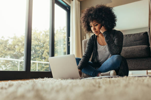 istock Female working on laptop at home 1073829582