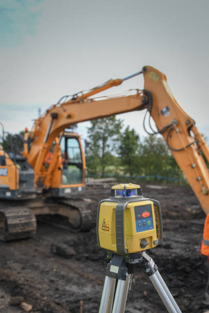 istock Earth level equipment - bulldozer in the background. 1073834222