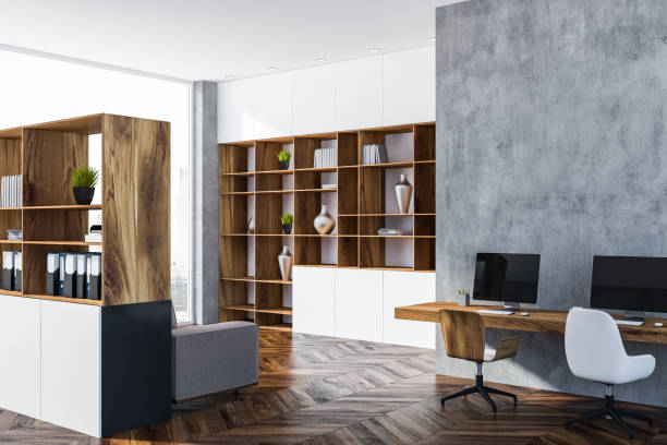 istock Gray home office corner, wooden bookcase 1073837938