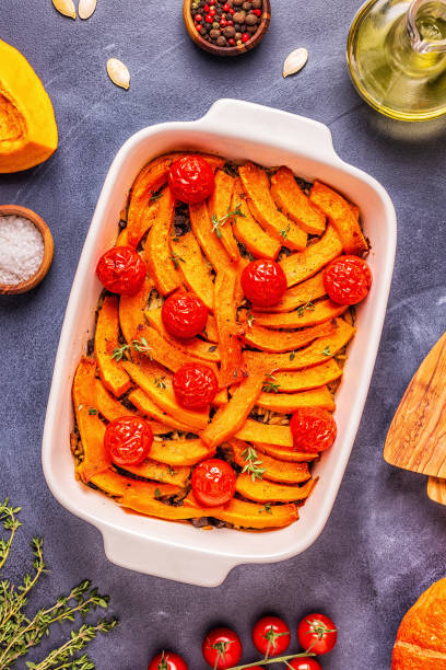 istock Pumpkin casserole with meat, rice, tomatoes 1073843438
