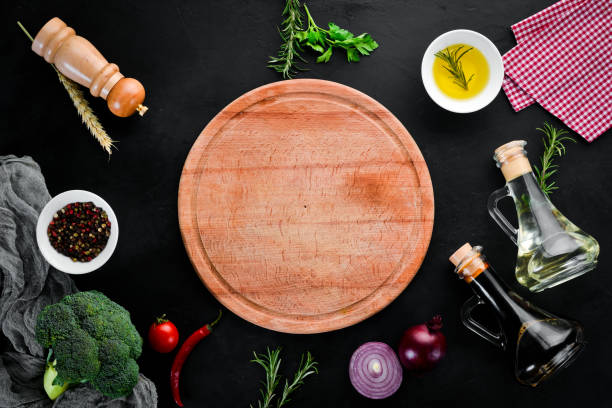 istock Preparing for cooking dishes. Kitchen wooden board. Top view. Free copy space. 1073845914
